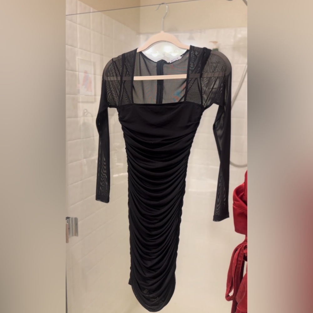 Beginning boutique long sleeved runched mini dress